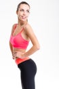 Attractive cheerful fitness girl in pink top and black leggings Royalty Free Stock Photo