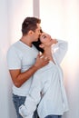 Attractive cheerful man and woman hugging. couple cuddling, love and romence concept
