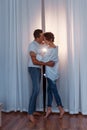 Attractive cheerful man and woman hugging. couple cuddling, love and romence concept