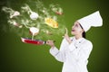 Attractive chef cooking with magic Royalty Free Stock Photo