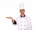 Attractive chef holding out his palm