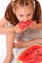 Attractive child eating watermelon