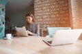 Attractive Chinese woman is using portable computer Royalty Free Stock Photo