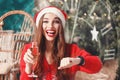 Attractive Christmas Woman Wearing Santa Hat Waiting For The New Year