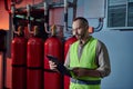 attractive concentrated bearded technician in safety