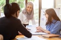 A confident Asian Muslim businesswoman is listening her teams ideas in the meeting Royalty Free Stock Photo