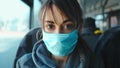 Mixed rase woman in protective mask in city public transport