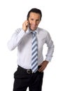 Attractive confident senior Hispanic businessman at work talking business on mobile phone standing Royalty Free Stock Photo