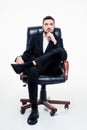 Attractive confident young bearded businessman sitting in office chair Royalty Free Stock Photo