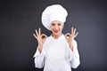 Attractive cook woman showing ok and smile Royalty Free Stock Photo