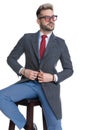 Attractive cool businessman holding hands on his coat`s button Royalty Free Stock Photo