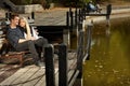 Attractive couple in autumn by lake Royalty Free Stock Photo