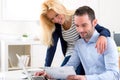 Attractive couple doing administrative paperwork Royalty Free Stock Photo