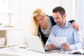 Attractive couple doing administrative paperwork Royalty Free Stock Photo