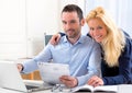 Attractive couple doing administrative paperwork Royalty Free Stock Photo