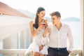 Attractive couple drinking cocktails ,enjoying summer vacation.Smiling,attracted to each other.Flirting and seduction Royalty Free Stock Photo
