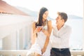 Attractive couple drinking cocktails ,enjoying summer vacation.Smiling,attracted to each other.Flirting and seduction Royalty Free Stock Photo