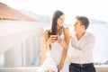 Attractive couple drinking cocktails ,enjoying summer vacation.Smiling,attracted to each other.Flirting and seduction Royalty Free Stock Photo