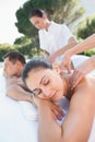 Attractive couple enjoying couples massage poolside Royalty Free Stock Photo