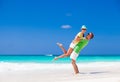 Attractive couple enjoying sunny day at Cayo Largo beach, Cuba