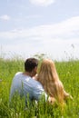 Attractive couple enjoying togetherness on meadow Royalty Free Stock Photo