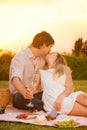 Attractive couple kissing on romantic picnic Royalty Free Stock Photo