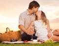 Attractive couple kissing on romantic picnic Royalty Free Stock Photo