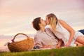 Attractive couple kissing on romantic picnic Royalty Free Stock Photo