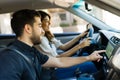 Attractive couple looking at the map in the car Royalty Free Stock Photo