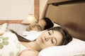 Attractive couple lying in bed sleeping Royalty Free Stock Photo