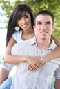 Attractive Couple in Park (Focus on Man) Royalty Free Stock Photo