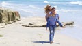 Attractive Couple Piggy Back Ride at the Beach Royalty Free Stock Photo