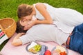 Attractive couple on romantic afternoon picnic kissing Royalty Free Stock Photo