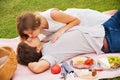 Attractive couple on romantic afternoon picnic kissing Royalty Free Stock Photo