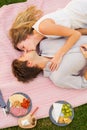Attractive couple on romantic afternoon picnic kissing Royalty Free Stock Photo