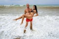 Attractive couple at the sea in summer overcast day Royalty Free Stock Photo