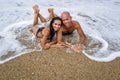 Attractive couple at the sea in summer overcast day Royalty Free Stock Photo