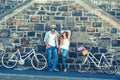 Attractive couple standing with bikes Royalty Free Stock Photo