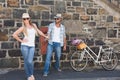 Attractive couple standing with bikes Royalty Free Stock Photo