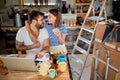 Attractive couple talking, hugging, holding hands, while planning new business. starting business concept Royalty Free Stock Photo