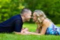 Attractive couple together on meadow Royalty Free Stock Photo