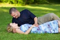 Attractive couple together on meadow Royalty Free Stock Photo