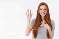 Attractive cute lovely redhead young girl blue eyes raise one hand hold palm heart promise give oath pledge loyalty