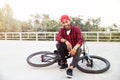 Attractive dark skinned boy sitting on his bicycle Royalty Free Stock Photo