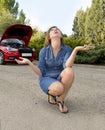 Attractive desperate and confused woman stranded on roadside with broken car engine failure crash accident calling on mobile phone Royalty Free Stock Photo