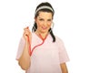 Attractive doctor woman showing stethoscope Royalty Free Stock Photo