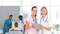 Attractive doctors attending to a patient Royalty Free Stock Photo