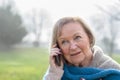 Attractive elderly woman talking on her mobile