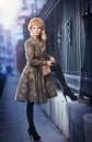 Attractive elegant blonde young woman wearing an outfit with Russian influence in urban fashion shot. Beautiful fashionable girl Royalty Free Stock Photo