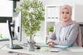 Attractive female muslim business office worker Royalty Free Stock Photo